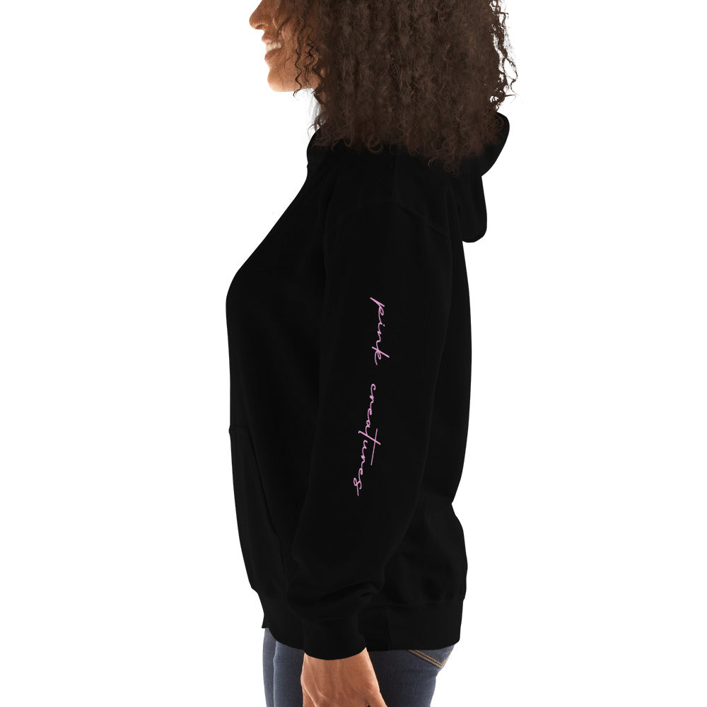pink creatures title in pink hoodie