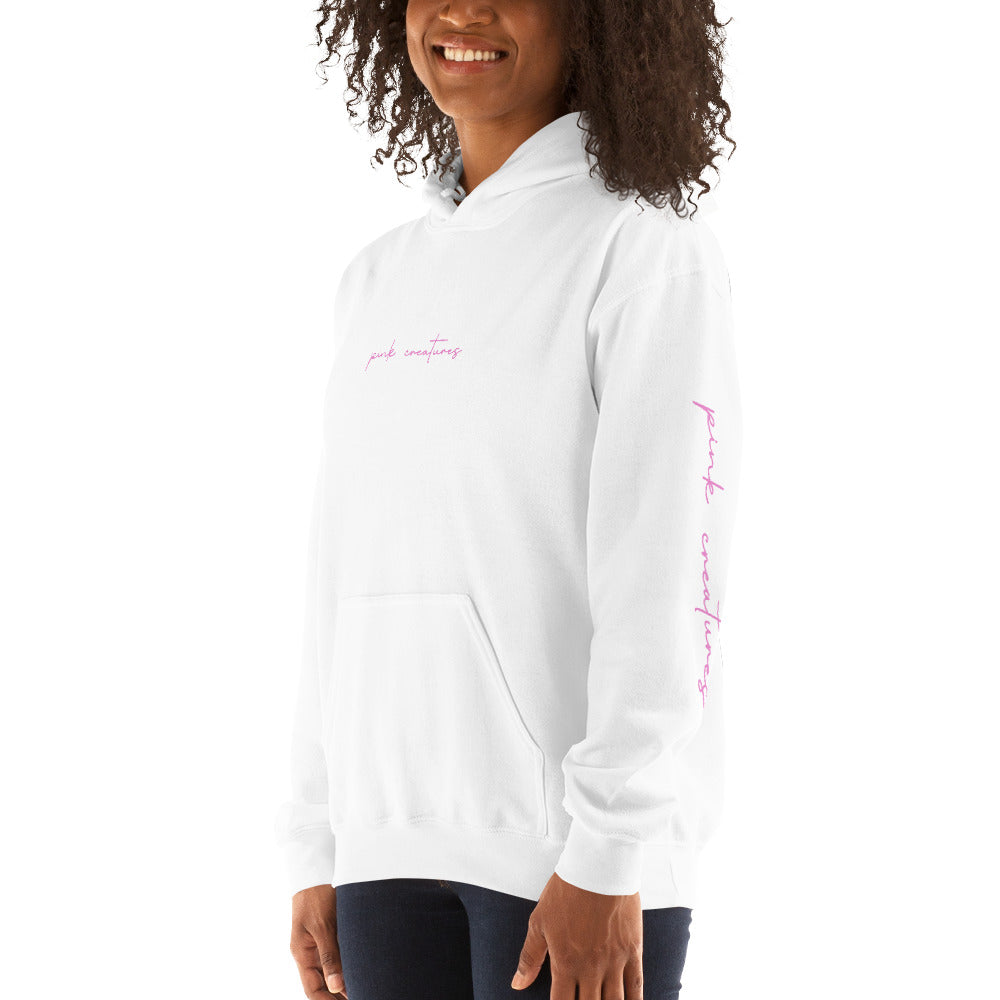 pink creatures title in pink hoodie