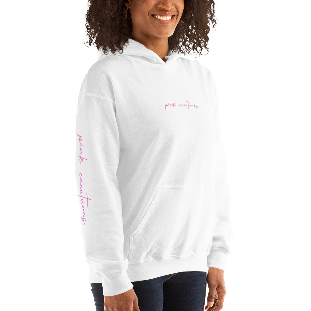pink creatures title in pink hoodie
