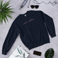 pink creatures title in pink crew neck