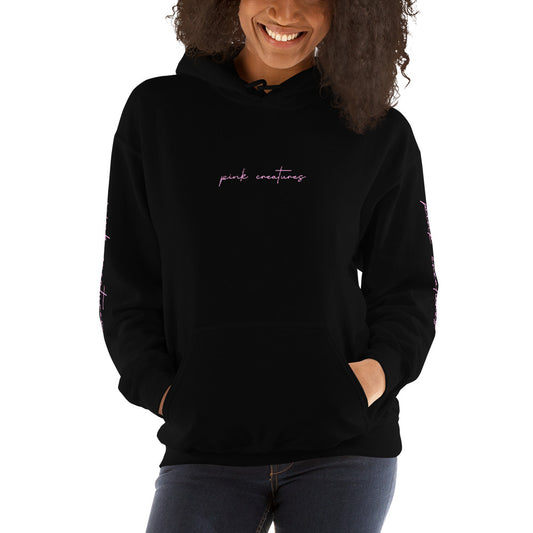 pink creatures title in pink hoodie