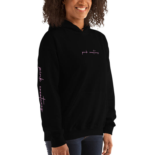 pink creatures title in pink hoodie